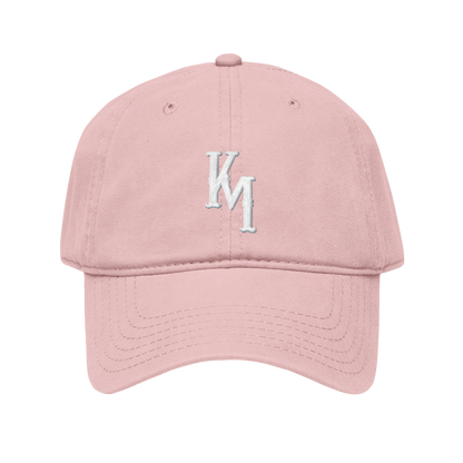 Pink cap with white logo on a white background