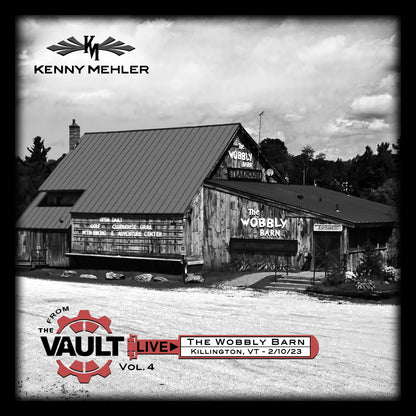 Black and white image of a barn with 'The Wobbly Barn' sign, featuring Kenny Mehler branding.